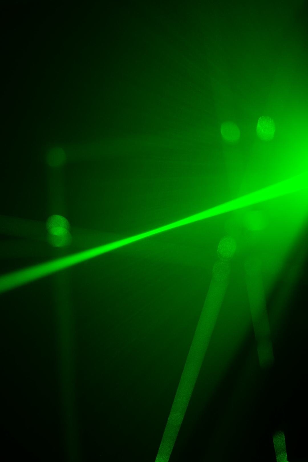 Green laser light representing Coherent's optical technology
